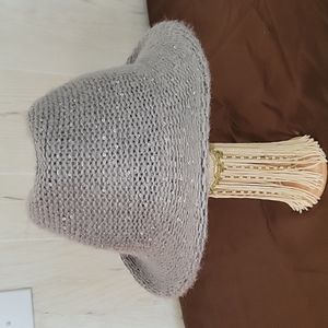 Gray hat with seqin sparkles and fuzzy softness. Adjustable size inside …